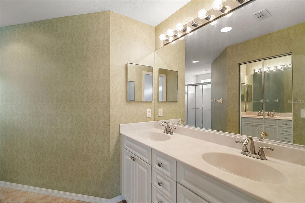 5368 Compass Point, Unit 202 Oxford, FL 34484 - Photo 21 of 33 a bathroom with a double vanity sink mirror and double
