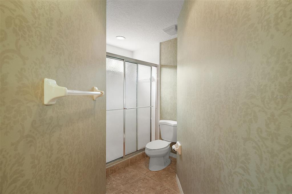 5368 Compass Point, Unit 202 Oxford, FL 34484 - Photo 23 of 33 a bathroom with a toilet