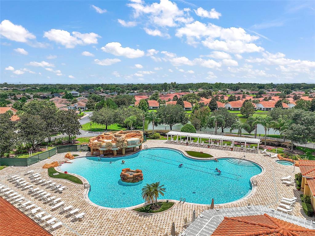 5368 Compass Point, Unit 202 Oxford, FL 34484 - Photo 30 of 33 a view of a swimming pool with lounge chair