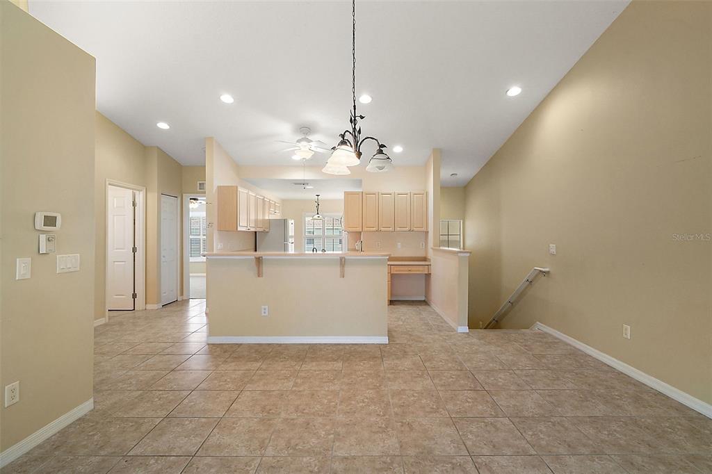 5368 Compass Point, Unit 202 Oxford, FL 34484 - Photo 9 of 33 a view of a kitchen with a sink and dishwasher cabinets