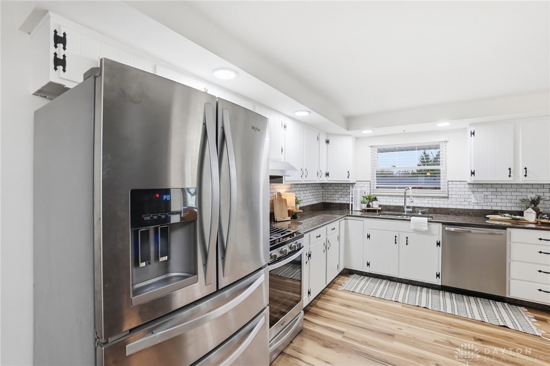 1628 Yorkshire Court Springfield, OH 45503 - Photo 12 of 47 This modern kitchen features sleek appliances and ample cabinet space, perfect for culinary endeavors.