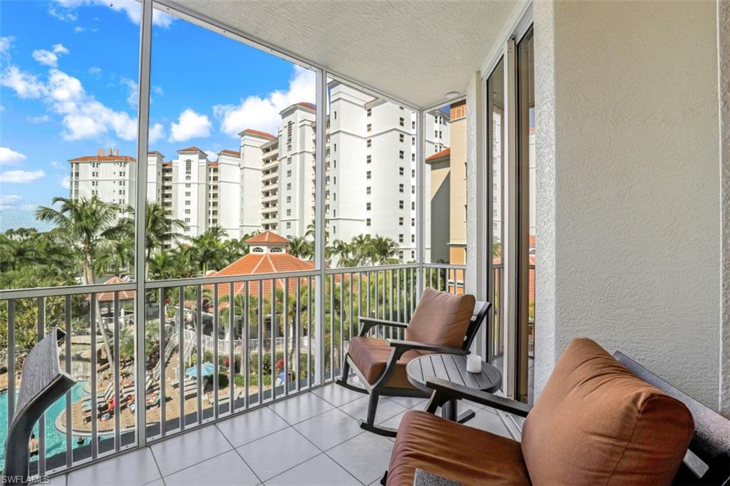 a view of a balcony with chairs