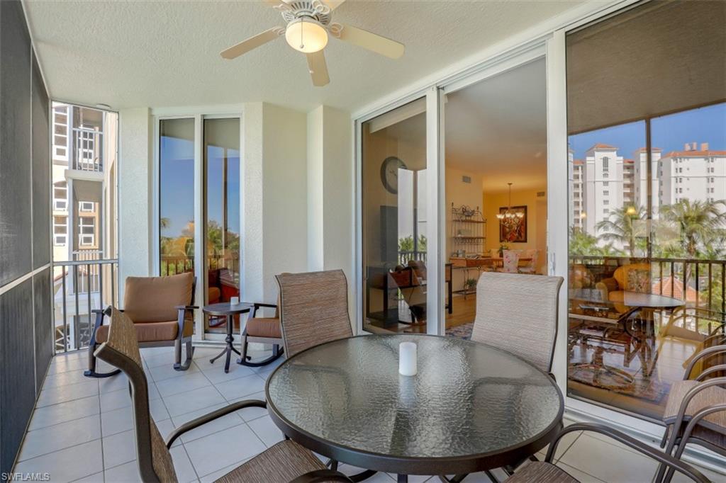 460 Launch Circle, Unit 403 Naples, FL 34108 - Photo 19 of 35 a living room with furniture and a large window
