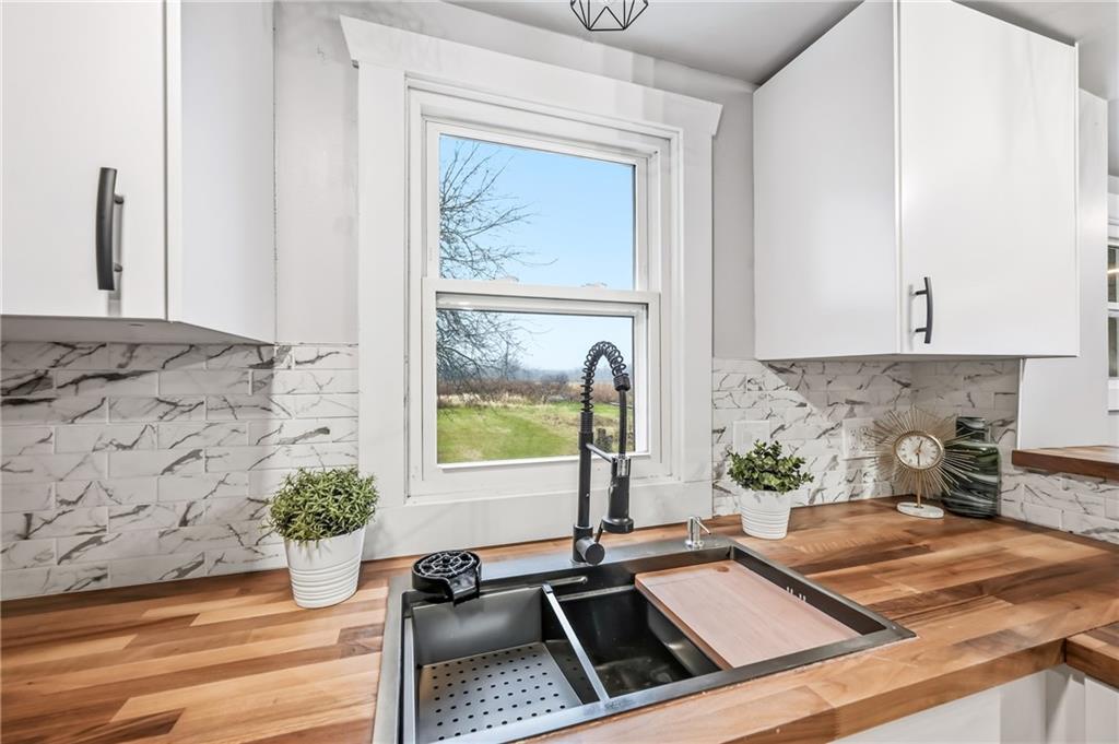 839 East Main St Extension Grove City, PA 16127 - Photo 14 of 41 a kitchen with sink refrigerator and window