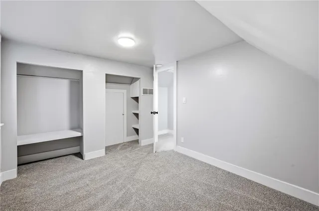 a view of wooden deck with a lake view