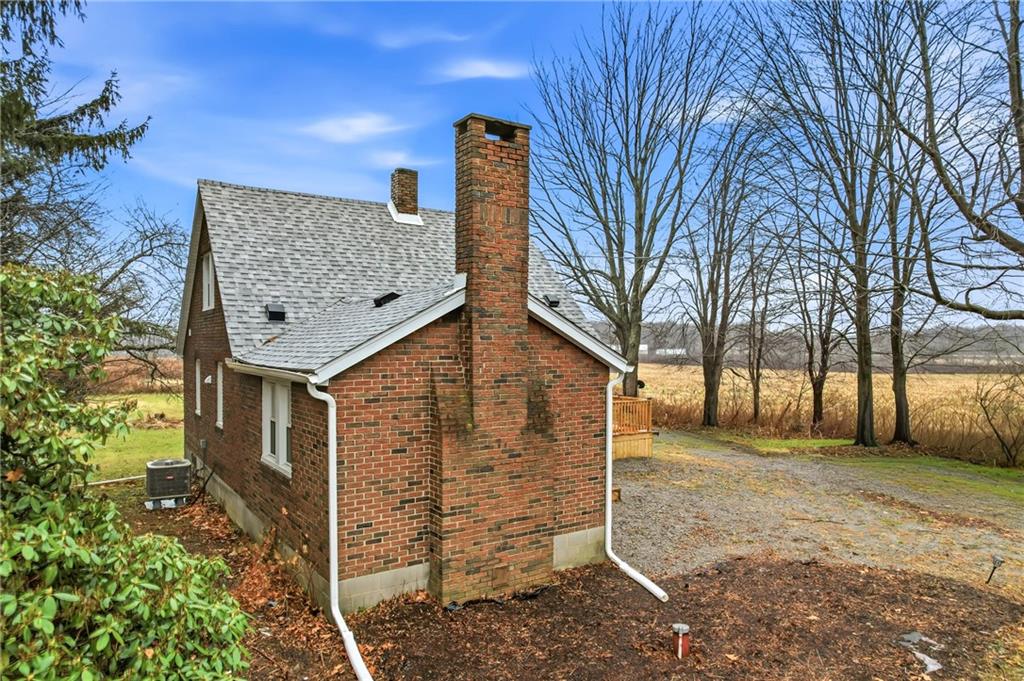 839 East Main St Extension Grove City, PA 16127 - Photo 3 of 41 a front view of a house with garden