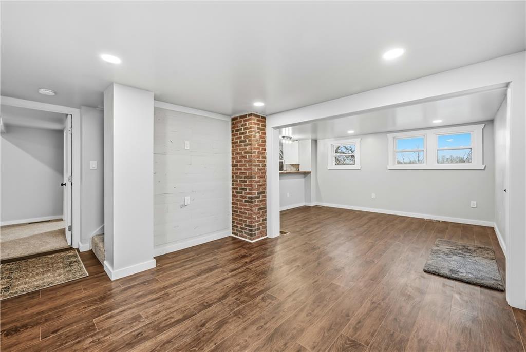 839 East Main St Extension Grove City, PA 16127 - Photo 7 of 41 an empty room with wooden floor and windows