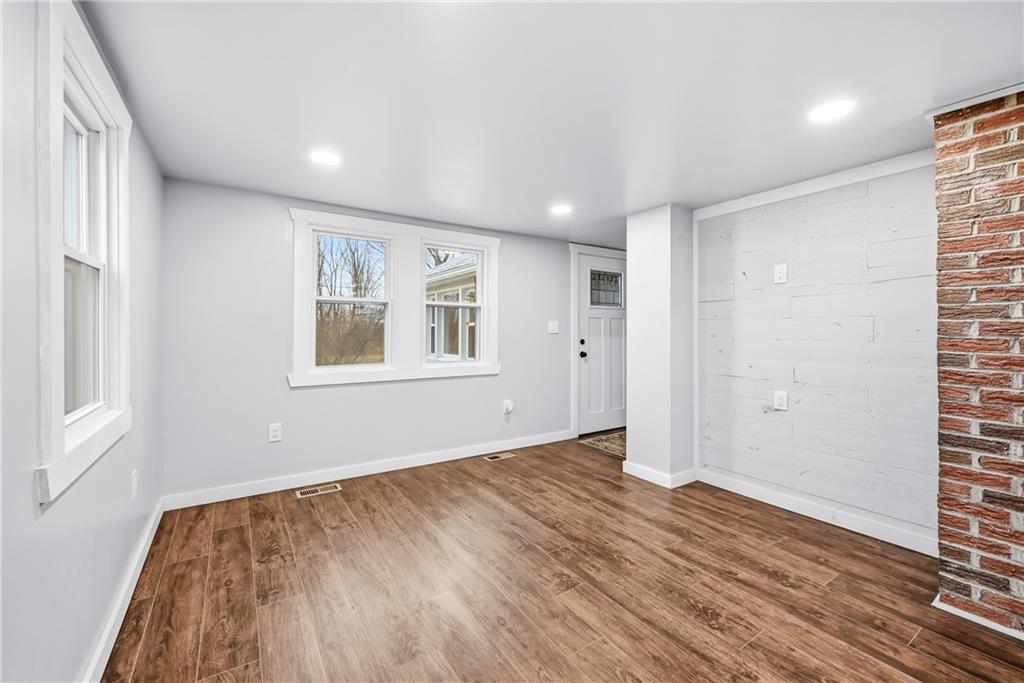 839 East Main St Extension Grove City, PA 16127 - Photo 8 of 41 a view of empty room with wooden floor and fan