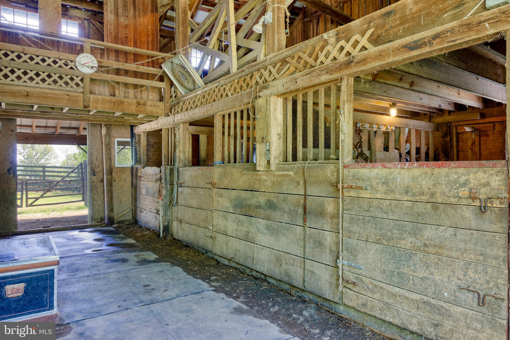 33195 Millville Road Upperville, VA 20184 - Photo 52 of 76 Three stalls on either side of the aisleway.