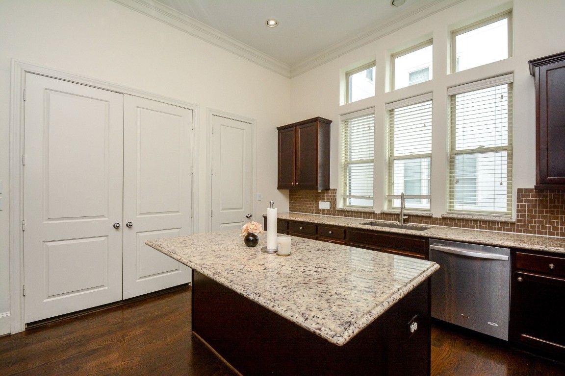 2017 Fannin Station Houston, TX 77045 - Photo 12 of 22 a kitchen with granite countertop a sink and a wooden floor