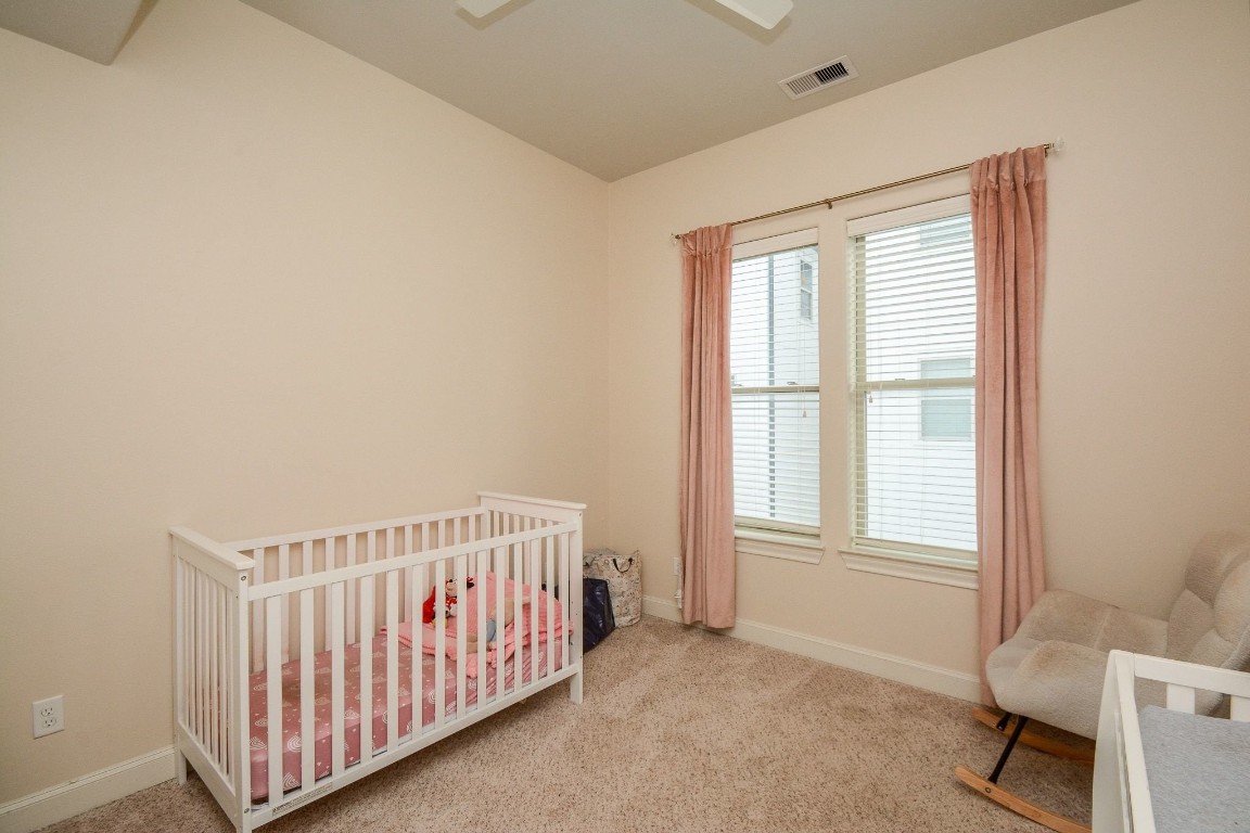 2017 Fannin Station Houston, TX 77045 - Photo 17 of 22 a view of a bedroom with furniture and windows