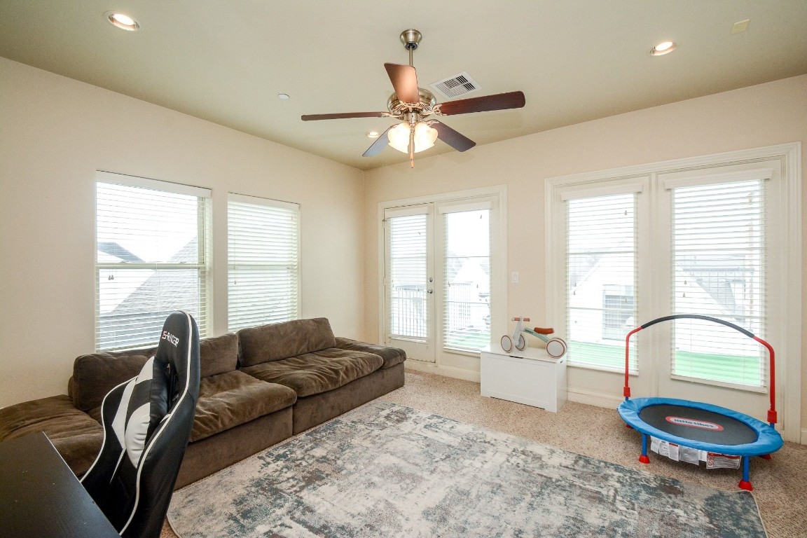 2017 Fannin Station Houston, TX 77045 - Photo 19 of 22 a living room with furniture and a large window