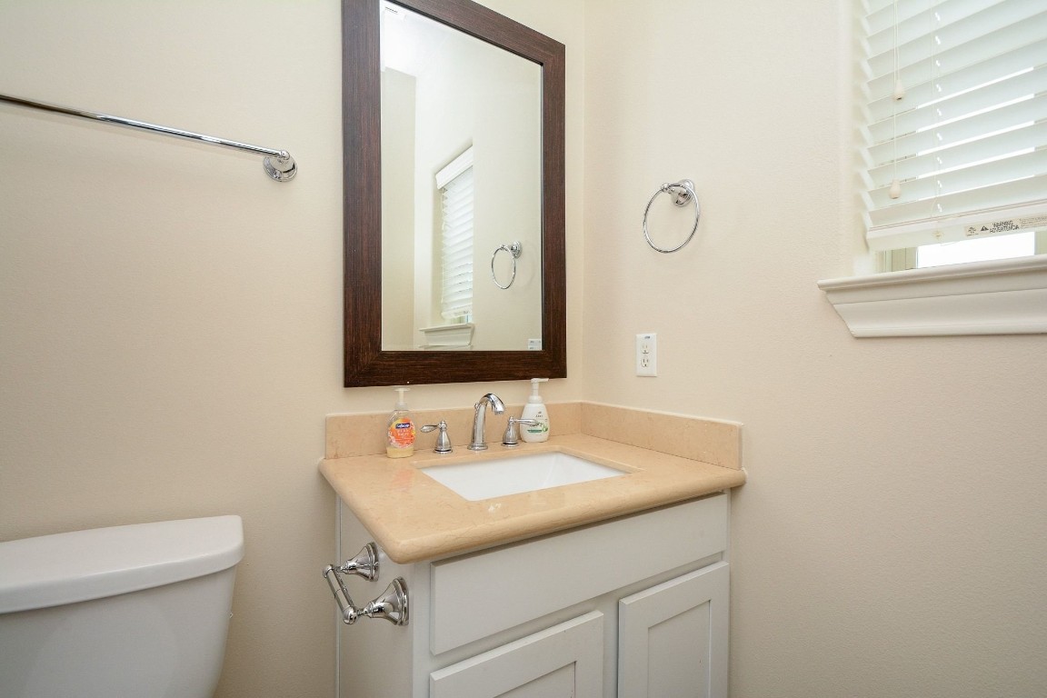 2017 Fannin Station Houston, TX 77045 - Photo 20 of 22 a bathroom with a sink and a mirror