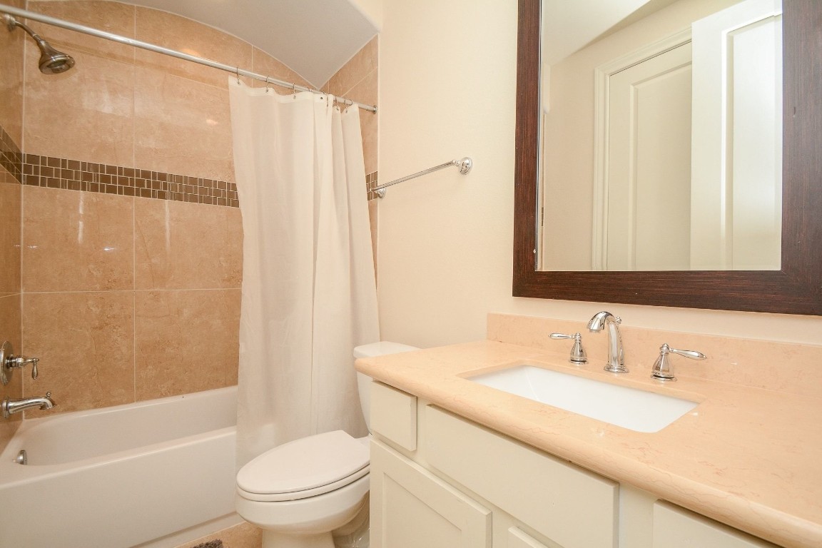 2017 Fannin Station Houston, TX 77045 - Photo 5 of 22 a bathroom with a granite countertop sink toilet and shower