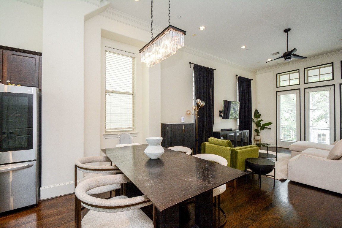 2017 Fannin Station Houston, TX 77045 - Photo 9 of 22 a living room with furniture a window and a chandelier
