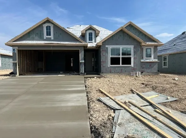 a front view of a house with yard