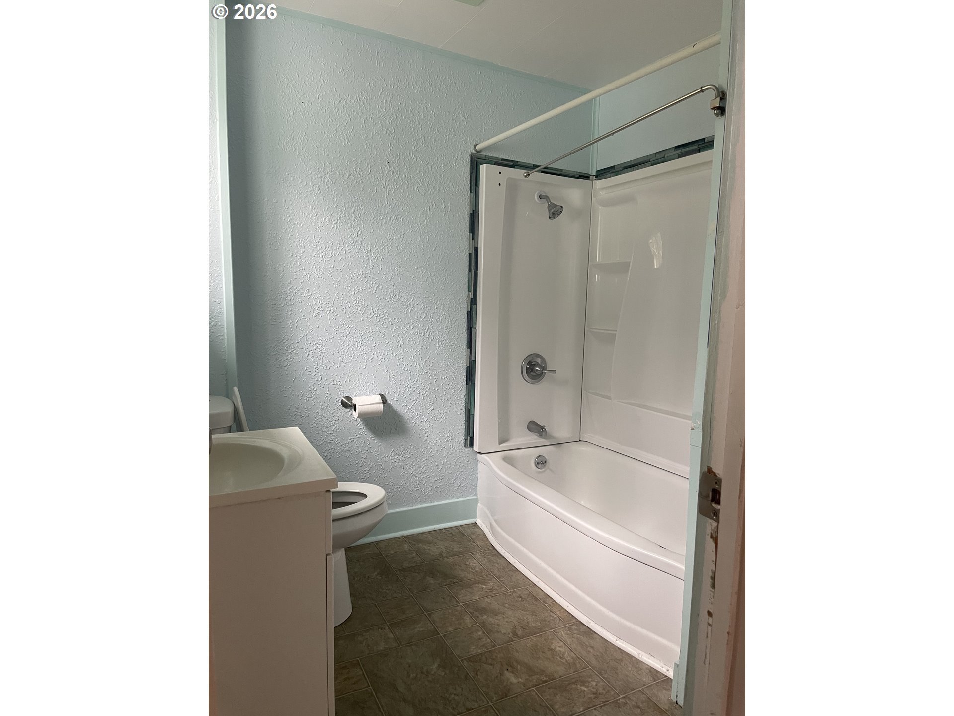 4045 Highway 101 Gearhart, OR 97138 - Photo 13 of 15 a bathroom with a tub and shower
