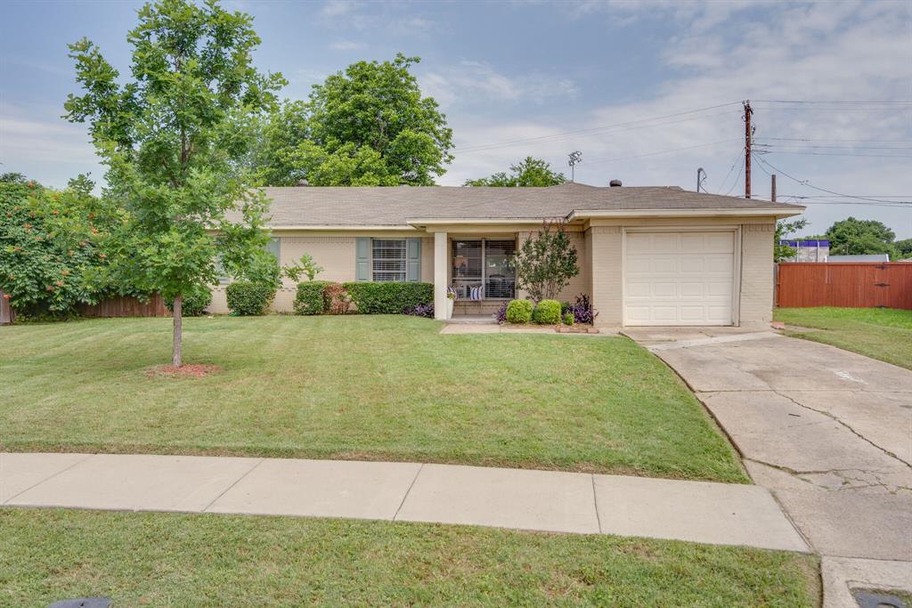 1230 Ridgeway Drive Richardson, TX 75080 - Photo 1 of 1 a front view of a house with a yard
