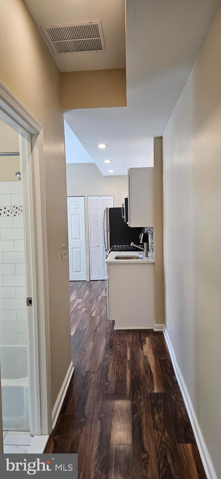 2016 1st Street Northwest, Unit 3 Washington, DC 20001 - Photo 2 of 18 a kitchen with a refrigerator and a stove top oven