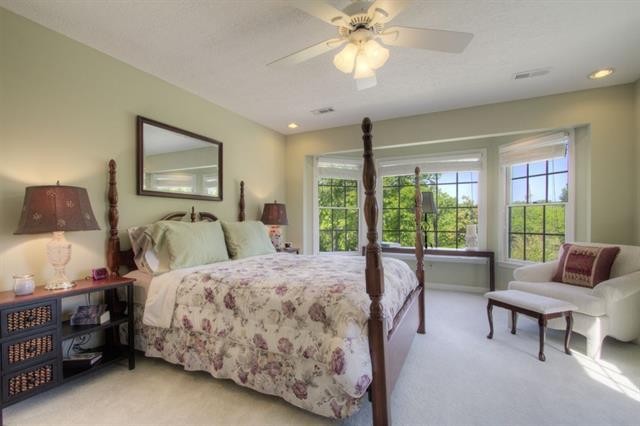 868 Reed Road Ten Mile, TN 37880 - Photo 23 of 40 a bedroom with a bed and a chandelier
