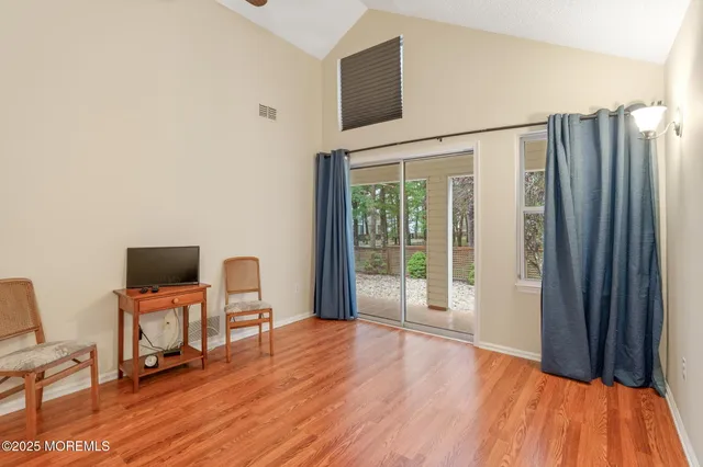 a view of a livingroom with furniture and wooden floor