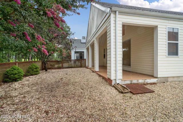 a view of a house with a small yard and plants