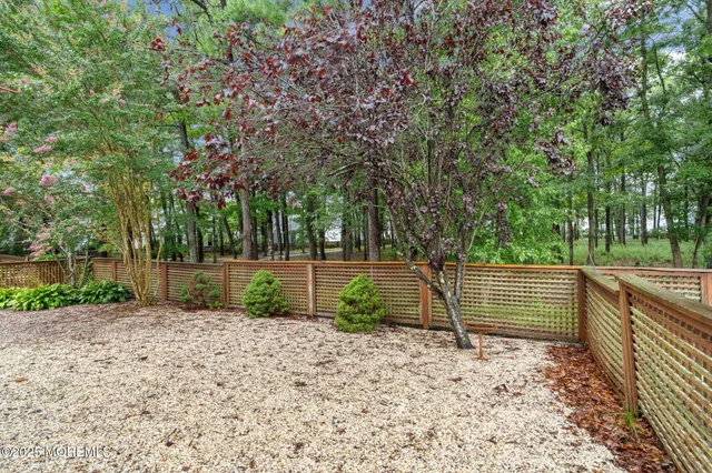 a view of park with large trees
