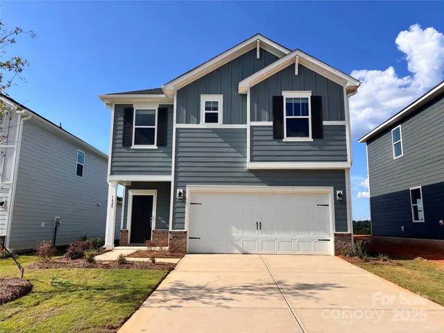 a front view of a house with yard