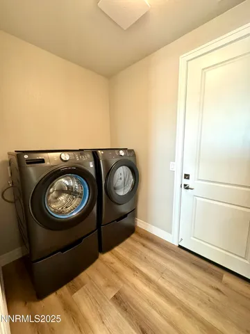 a view of a hardwood floor in a room