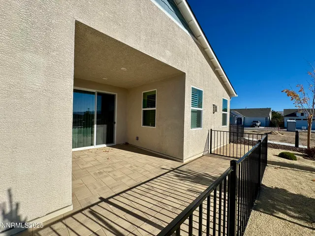 a balcony view with a seating space