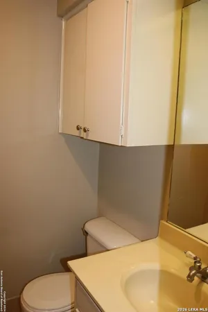 a bathroom with a toilet and sink