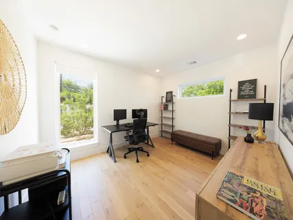 a workspace with furniture and wooden floor