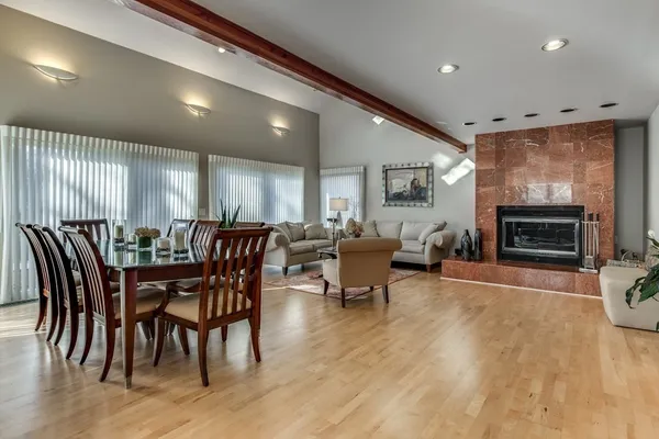 a view of a dining room with furniture window and wooden floor