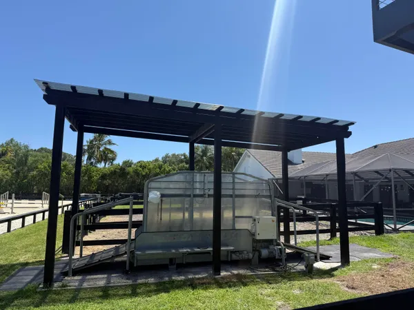 a view of a swimming pool with a patio