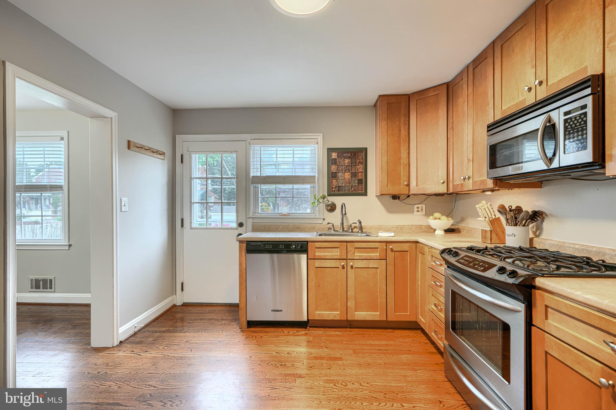 8132 Pleasant Plains Road Towson, MD 21286 - Photo 15 of 55 a kitchen with stainless steel appliances granite countertop a stove a sink and a microwave