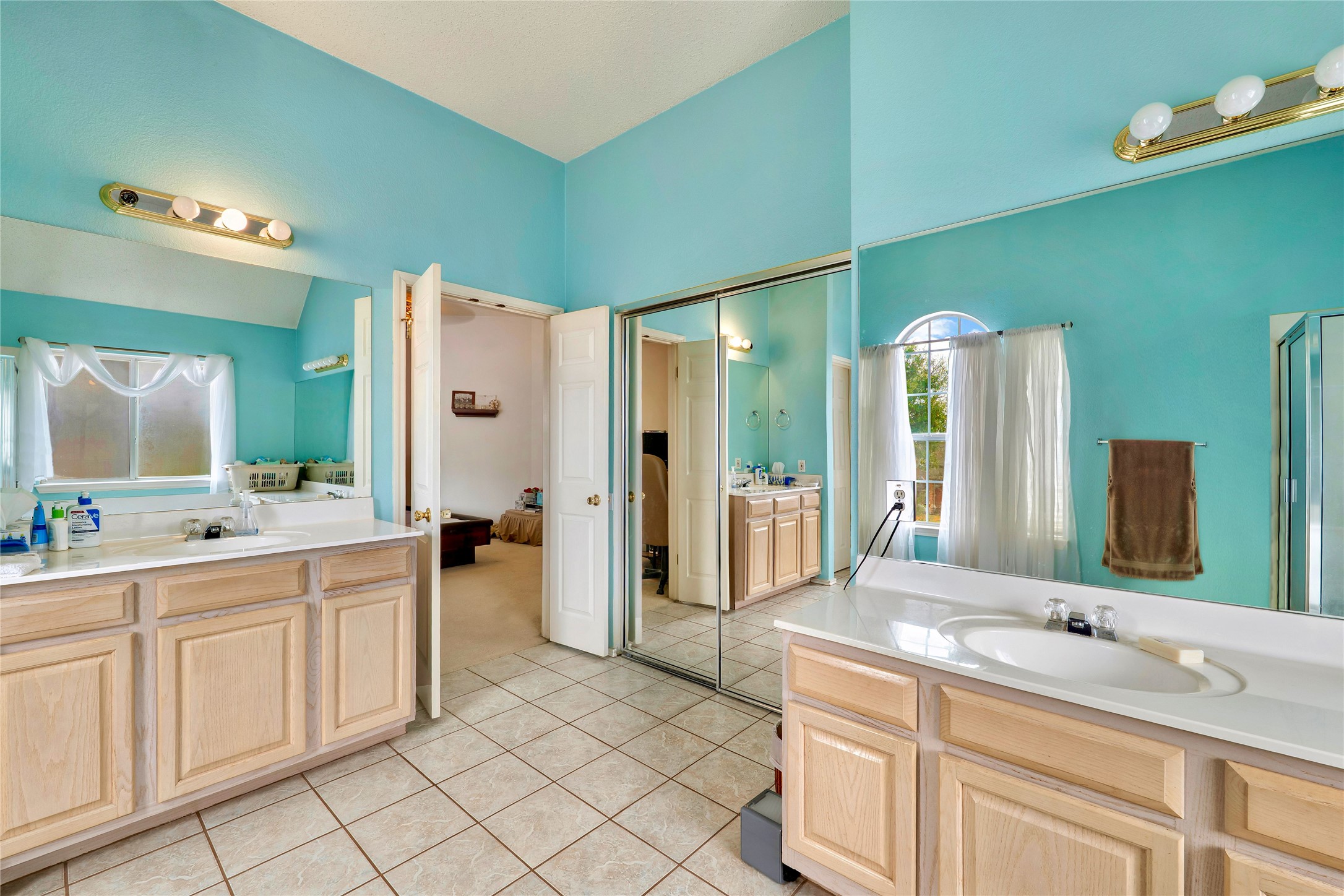 4008 Springwillow Lane Round Rock, TX 78681 - Photo 12 of 29 Primary bathroom with two vanities and light tile patterned floors