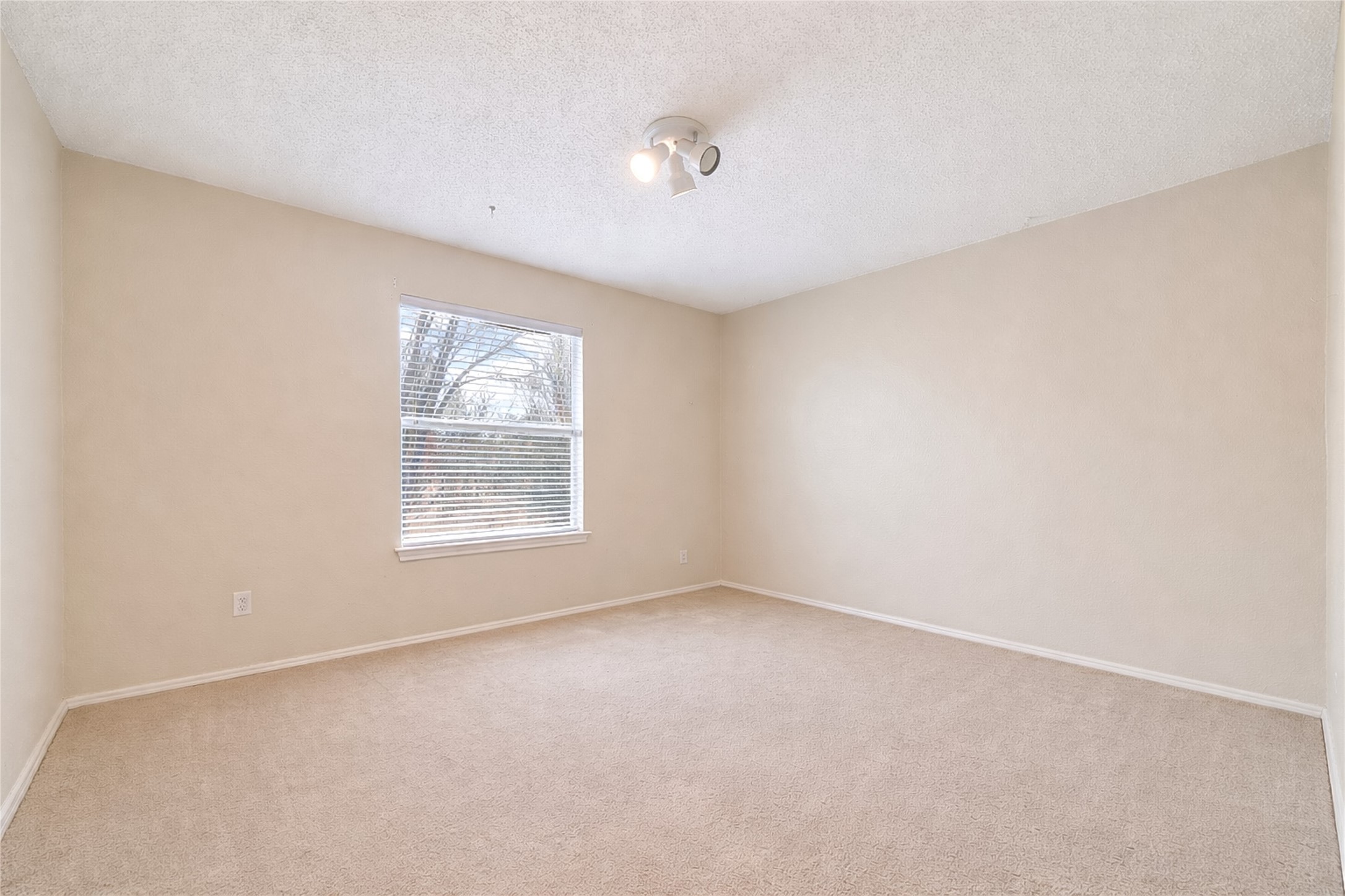 4008 Springwillow Lane Round Rock, TX 78681 - Photo 15 of 29 Virtually staged - Bedroom #2 featuring ceiling fan and a textured ceiling