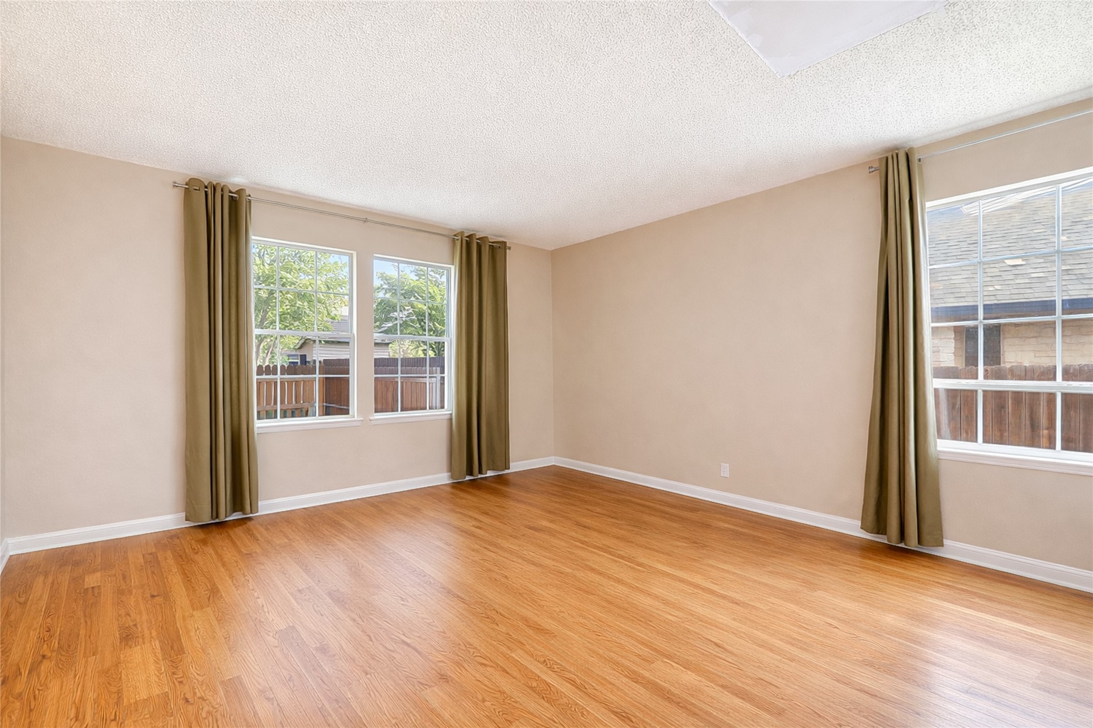 4008 Springwillow Lane Round Rock, TX 78681 - Photo 9 of 29 Virtually staged - Flex room featuring light wood-style flooring and a textured ceiling