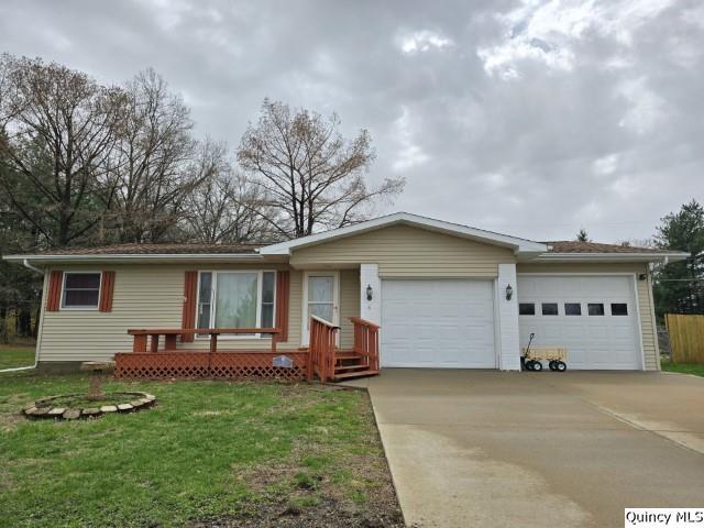 a front view of house with yard and outdoor seating