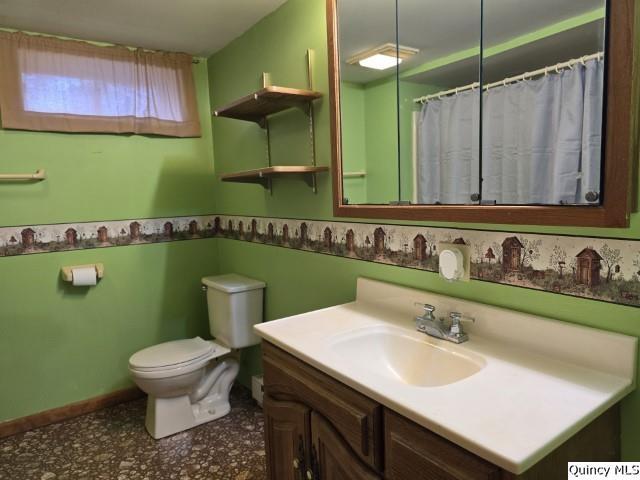 6 Westview Drive Hamilton, IL 62341 - Photo 18 of 30 a bathroom with a sink a toilet and a mirror