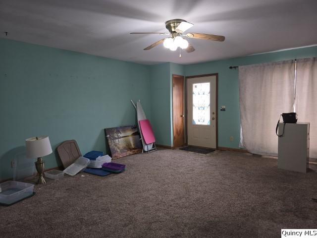 6 Westview Drive Hamilton, IL 62341 - Photo 4 of 30 a living room with furniture and a chandelier
