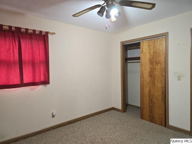 6 Westview Drive Hamilton, IL 62341 - Photo 9 of 30 an empty room with a ceiling fan and a window