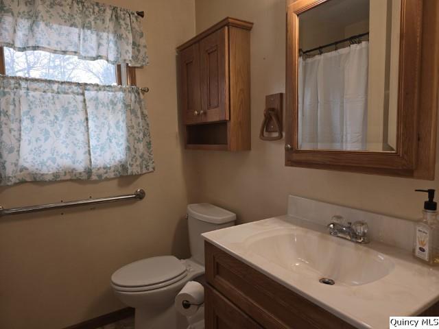 6 Westview Drive Hamilton, IL 62341 - Photo 10 of 30 a bathroom with a sink toilet and mirror