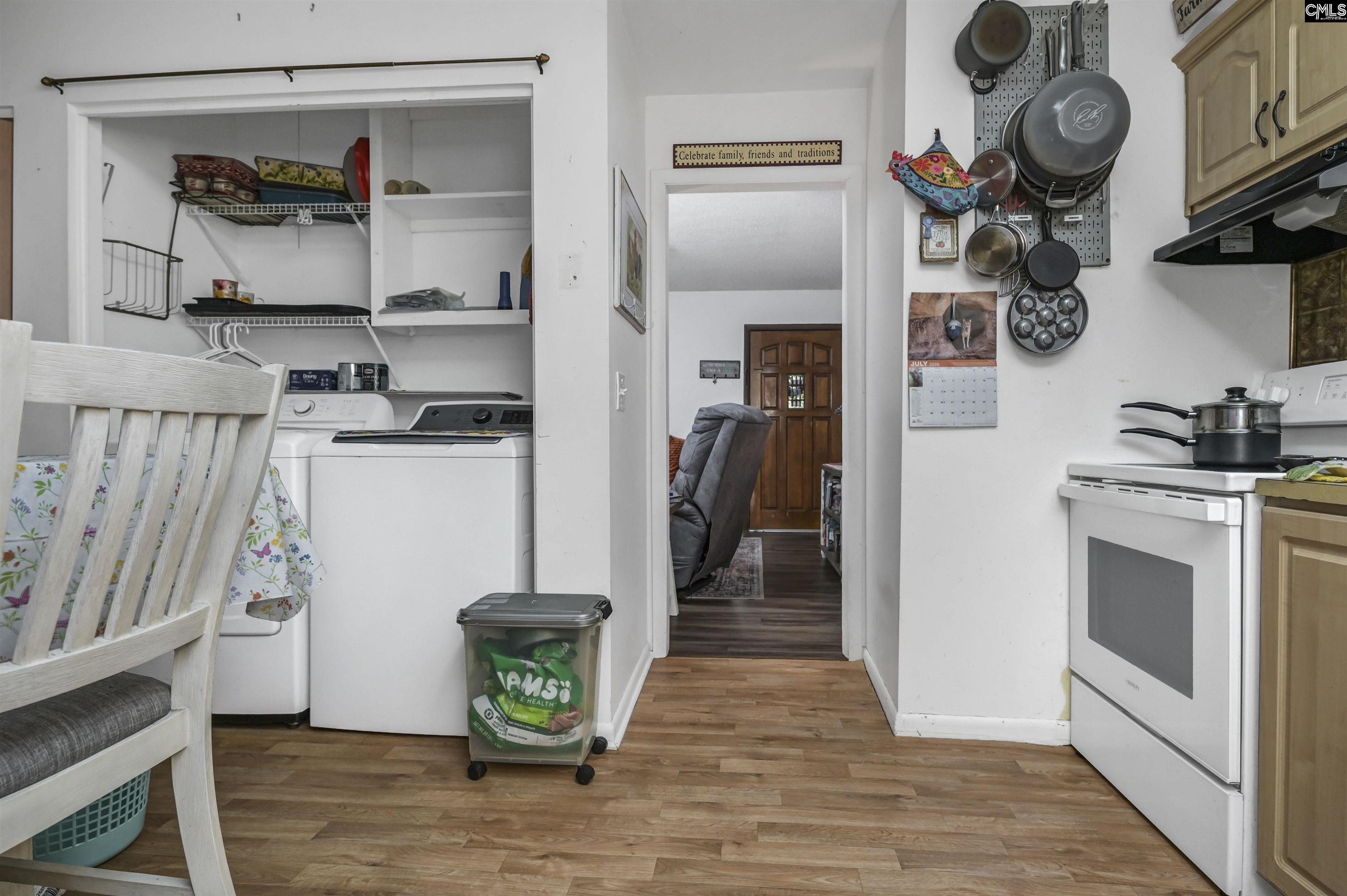 133 Sunset Strip Elgin, SC 29045 - Photo 13 of 30 a kitchen with stainless steel appliances granite countertop a refrigerator a stove and a wooden floors