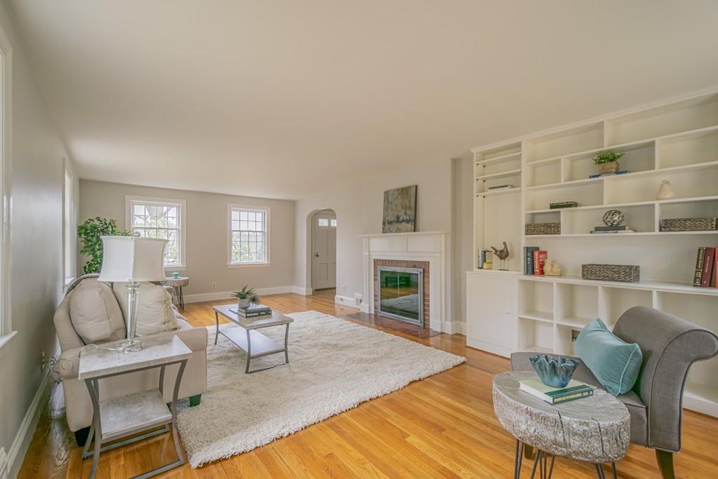 5 Constitution Road Lexington, MA 02421 - Photo 4 of 42 a living room with furniture and a fireplace