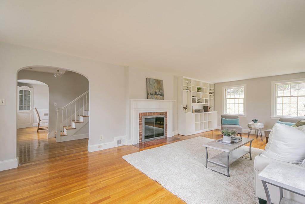 5 Constitution Road Lexington, MA 02421 - Photo 5 of 42 a living room with furniture fireplace and window