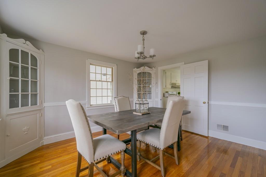 5 Constitution Road Lexington, MA 02421 - Photo 7 of 42 a view of a dining room with furniture and wooden floor