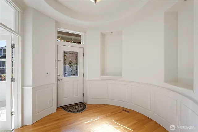 a view of a room with wooden floor and cabinet