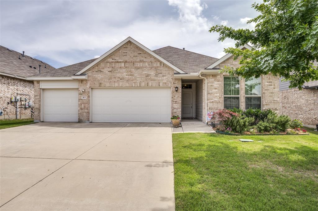 413 Wiggins Way Van Alstyne, TX 75495 - Photo 1 of 25 Brick exterior residence featuring a two-car garage, concrete driveway, and front lawn