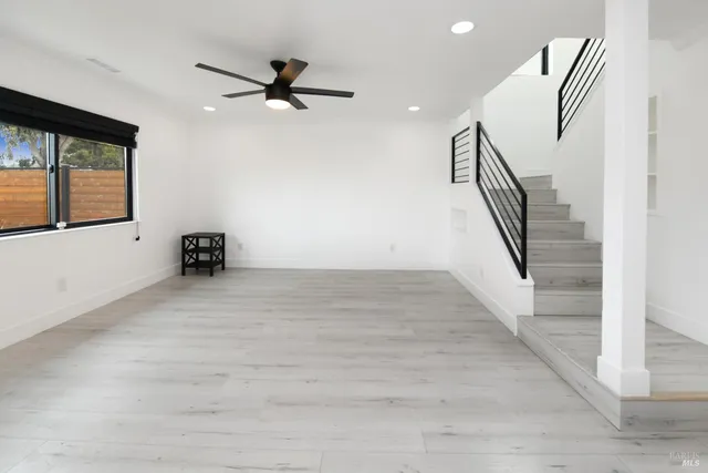 a kitchen with stainless steel appliances a refrigerator and a cabinets